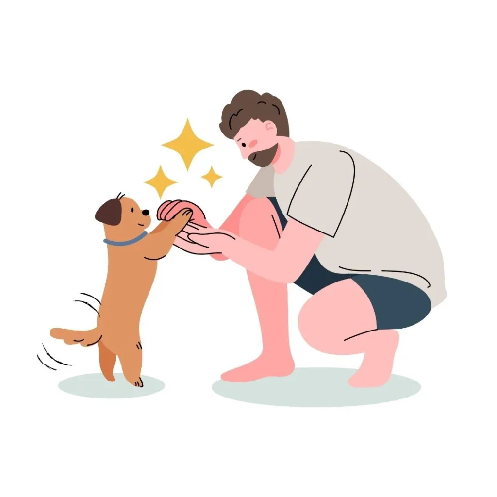 Hombre jugando con su perro, dándole la pata con alegría.